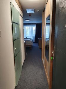 A bed or beds in a room at miniHotel Pápa Még 1 kép