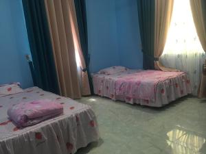 Katil atau katil-katil dalam bilik di Cikgu CTZ Homestay (B)