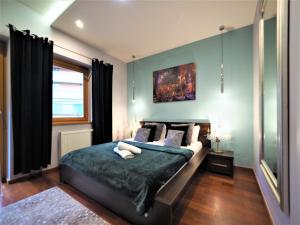 Posteľ alebo postele v izbe v ubytovaní VIP Apartamenty Gorące Źródła