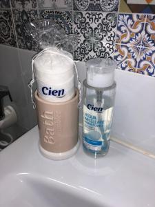 a container of green and a container of clear on a counter at Seacily house in Mazara del Vallo