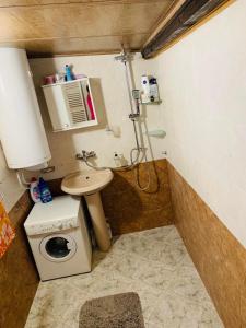 a small bathroom with a toilet and a sink at Къща за гости Голямо Дряново in Golyamo Dryanovo +13 photos