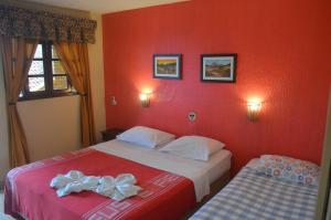 Postel nebo postele na pokoji v ubytování Hotel Pousada Viking