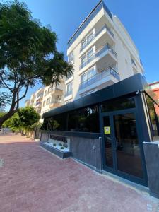 a building with a glass door in front of it at LONDON OTEL in Antalya