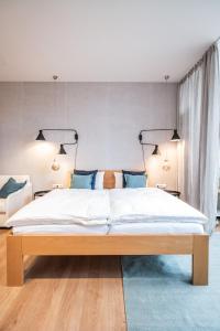 Uma cama ou camas num quarto em Apartments Leopold Ferdinand