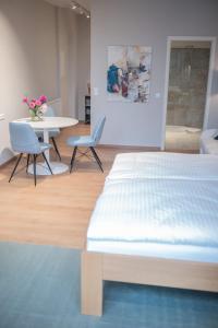 Postel nebo postele na pokoji v ubytování Apartments Leopold Ferdinand