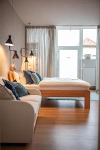 Postel nebo postele na pokoji v ubytování Apartments Leopold Ferdinand