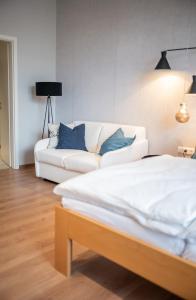 Postel nebo postele na pokoji v ubytování Apartments Leopold Ferdinand