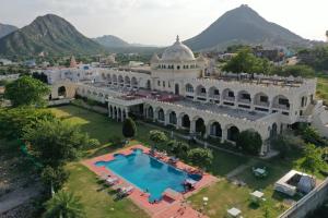 an aerial view of a building with a swimming pool at Gulaab Niwaas Palace in Pushkar