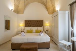A bed or beds in a room at Amatè Suite