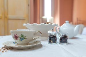 a tea cup and saucer on a table at Antico Portale Acquasparta in Acquasparta