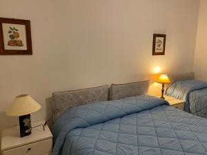 Voodi või voodid majutusasutuse Hotel Le Logge toas