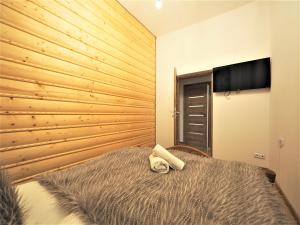 Posteľ alebo postele v izbe v ubytovaní VIP Apartamenty TYTUS