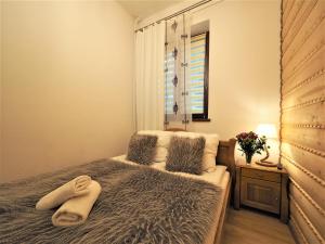 Posteľ alebo postele v izbe v ubytovaní VIP Apartamenty TYTUS