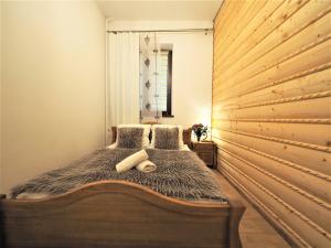 Posteľ alebo postele v izbe v ubytovaní VIP Apartamenty TYTUS