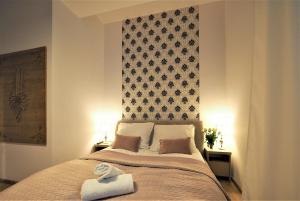 Posteľ alebo postele v izbe v ubytovaní VIP Apartamenty TYTUS