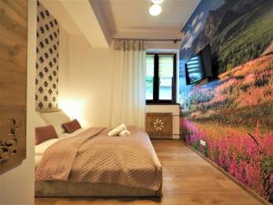 Posteľ alebo postele v izbe v ubytovaní VIP Apartamenty TYTUS