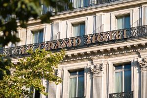 a building with a sign on the side of it at InterContinental Paris Le Grand, an IHG Hotel in Paris