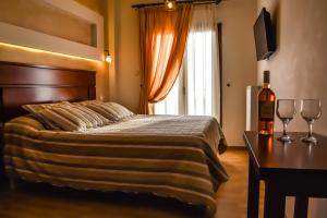 Posteľ alebo postele v izbe v ubytovaní Tasia Mountain Hotel
