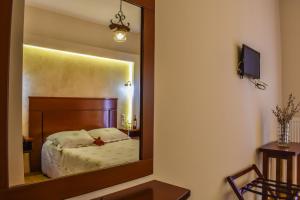 Posteľ alebo postele v izbe v ubytovaní Tasia Mountain Hotel