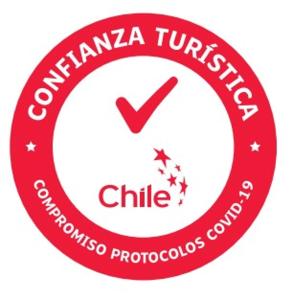 a red circle with the words columbia tulsa franchise and a child at Hostal del gato in Valparaíso