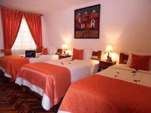 Postel nebo postele na pokoji v ubytování Hotel Puno Terra + 37 fotografií
