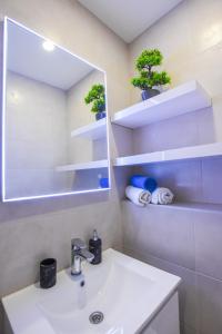 Ванная комната в Apartmani Plazibat