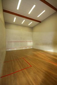 an empty room with a basketball court with a wooden floor at Bentleys Motor Inn in Palmerston North