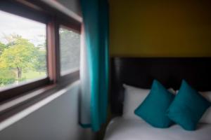 Postel nebo postele na pokoji v ubytování Asilé Hotel Boutique