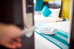 Postel nebo postele na pokoji v ubytování Asilé Hotel Boutique