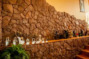 a stone wall with a shelf with shoes on it at SN Hotel in Sloboda Zasluchʼ