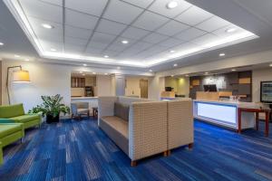 a lobby of a hospital with couches and chairs at Holiday Inn Express Hotel & Suites King of Prussia, an IHG Hotel in King of Prussia