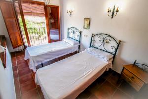 Posteľ alebo postele v izbe v ubytovaní Finca Pere - panoramic hillside holiday house in Benissa + 20 fotografií