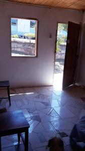 an empty room with a door and a window at Casa Rustica Milho Verde in Milho Verde
