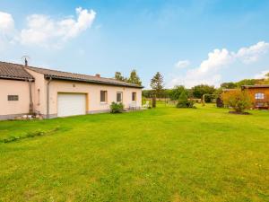 a large yard in front of a house at Idyllic Bungalow in Pepelow with Garden near Seabeach in Pepelow