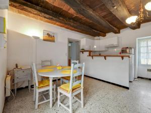 a kitchen and dining room with a table and chairs at Holiday home in Cendrieux with garden shed in Cendrieux