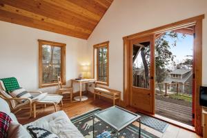 a living room with a couch and a window at Little Refuge in town in Eastsound