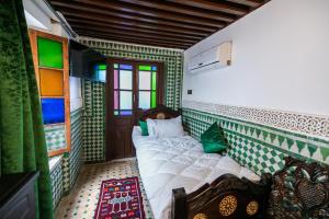 Postel nebo postele na pokoji v ubytování Palais Riad Chahd Luxury