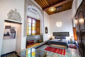Postel nebo postele na pokoji v ubytování Palais Riad Chahd Luxury