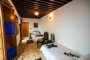 Postel nebo postele na pokoji v ubytování Palais Riad Chahd Luxury