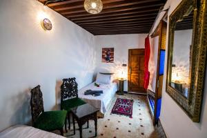 Postel nebo postele na pokoji v ubytování Palais Riad Chahd Luxury