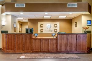 a lobby with a waiting area with two chairs at Comfort Inn & Suites Galt - Lodi North in Galt