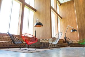a row of chairs in a room with windows at Okinawa Grand Mer Resort in Okinawa City