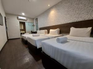 Voodi või voodid majutusasutuse MIICO Hotel @ Mount Austin toas