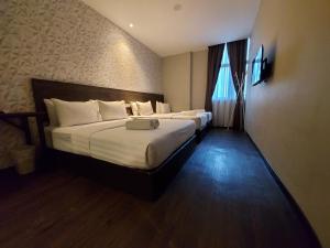 Voodi või voodid majutusasutuse MIICO Hotel @ Mount Austin toas