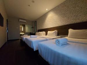 Voodi või voodid majutusasutuse MIICO Hotel @ Mount Austin toas