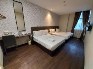 Voodi või voodid majutusasutuse MIICO Hotel @ Mount Austin toas