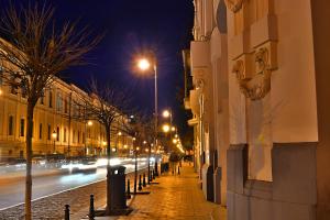 a city street at night with street lights at Taste Tbilisi in Tbilisi City