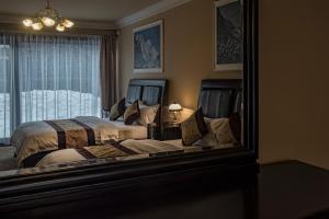 Posteľ alebo postele v izbe v ubytovaní Mountain Resort Residences