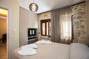 A bed or beds in a room at Carya Residence