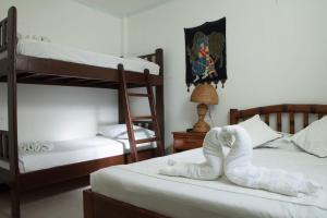 Isla Gecko Resort tesisinde bir ranza yatağı veya ranza yatakları